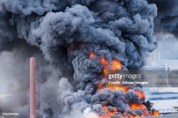 building in fire - black smoke stock pictures, royalty-free photos & images