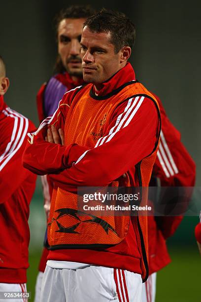 Jamie Carragher looks on during the Liverpool training session, ahead of the UEFA Champions League group E match against Lyon, at the Stade Gerland...