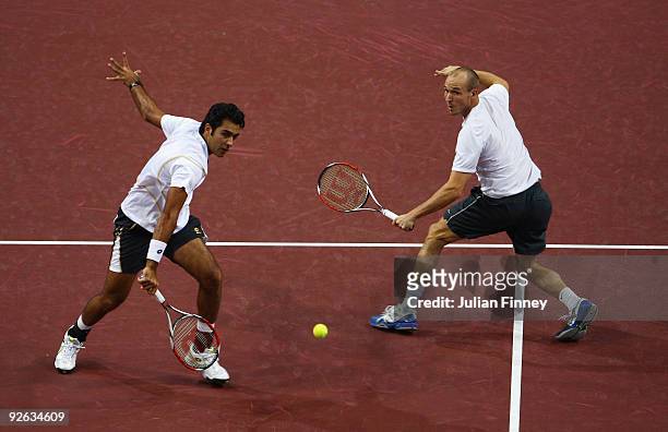James Cerretani of the USA and Aisam-ul-Haq Qureshi of Pakistan in action in their match against Roger Federer and Marco Chiudinelli of Switzerland...