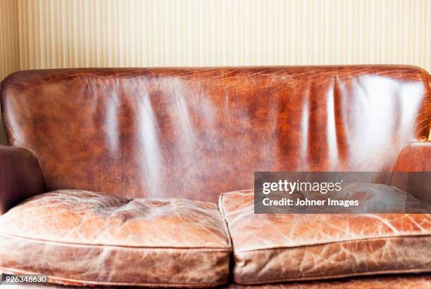 old leather sofa - leather couch stock pictures, royalty-free photos & images