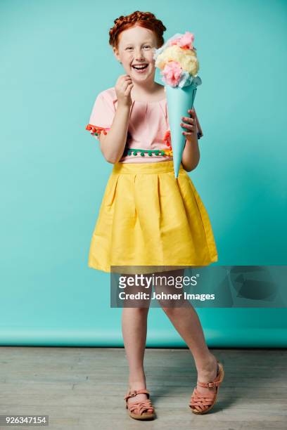 laughing girl holding toy ice-cream cone - cotton candy stock pictures, royalty-free photos & images