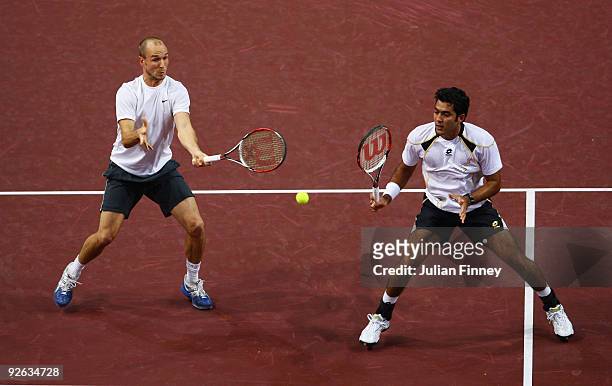 James Cerretani of USA and Aisam-ul-Haq Qureshi of Pakistan in action in their match against Roger Federer and Marco Chiudinelli of Switzerland in...