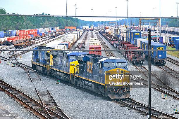 Locomotive makes its way out of a railyard depot in Jacksonville, Florida, U.S., on Wednesday, Oct. 28, 2009. Warren Buffett's Berkshire Hathaway...