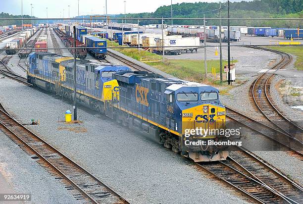 Locomotive makes its way out of a railyard depot in Jacksonville, Florida, U.S., on Wednesday, Oct. 28, 2009. Warren Buffett's Berkshire Hathaway...