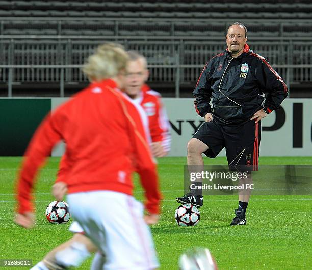 Rafa Benitez manager of Liverpool watches during a training session prior to the UEFA Champions League Group E match between Liverpool and Lyon at...