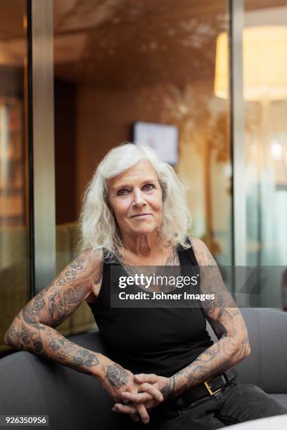 portrait of senior woman with tattoos - old woman tattoos stock pictures, royalty-free photos & images