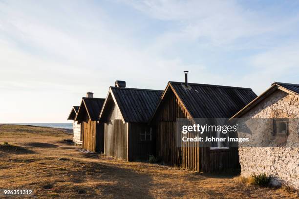 houses and barns near sea coast - faro sweden bildbanksfoton och bilder