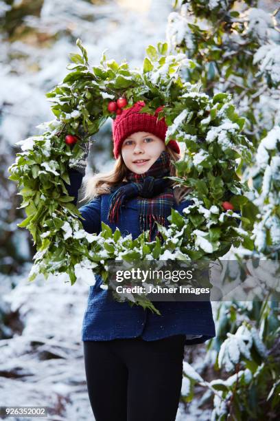 girl holding christmas wreath - national day in sweden 2017 stock pictures, royalty-free photos & images