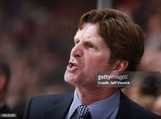 Head coach Mike Babcock of the Detroit Red Wings looks on from the bench during their game against the Vancouver Canucks at General Motors Place on...