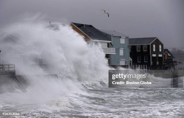 Waves crash onto houses along Turner Road in Scituate, MA during a noreaster storm on March 2, 2018.