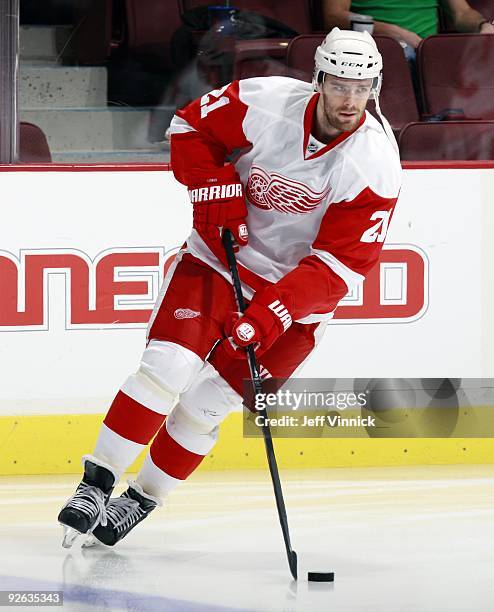 Ville Leino of the Detroit Red Wings skates up ice with the puck during their game against the Vancouver Canucks at General Motors Place on October...