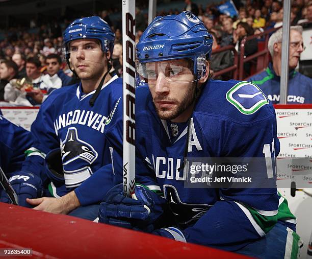 Ryan Kesler and Steve Bernier of the Vancouver Canucks look on from the bench during their game against the Detroit Red Wings at General Motors Place...