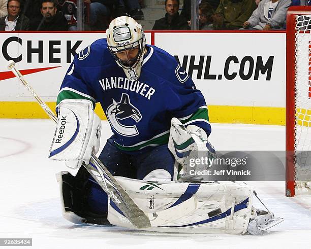 Roberto Luongo of the Vancouver Canucks makes a save during their game against the Detroit Red Wings at General Motors Place on October 27, 2009 in...