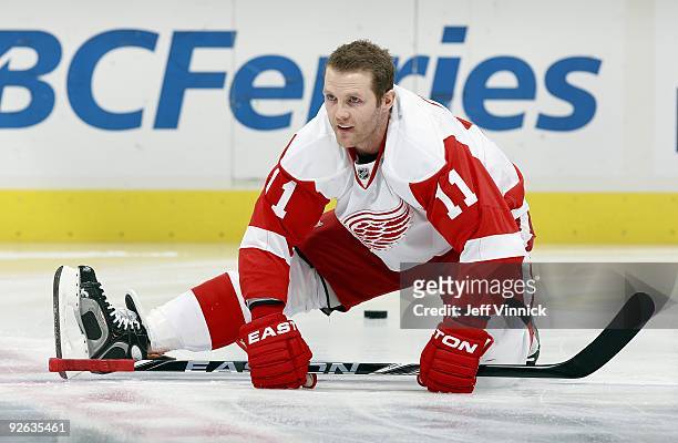 Dan Cleary of the Detroit Red Wings stretches during their game against the Vancouver Canucks at General Motors Place on October 27, 2009 in...