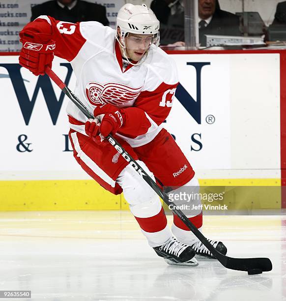 Pavel Datsyuk of the Detroit Red Wings skates up ice with the puck during their game against the Vancouver Canucks at General Motors Place on October...