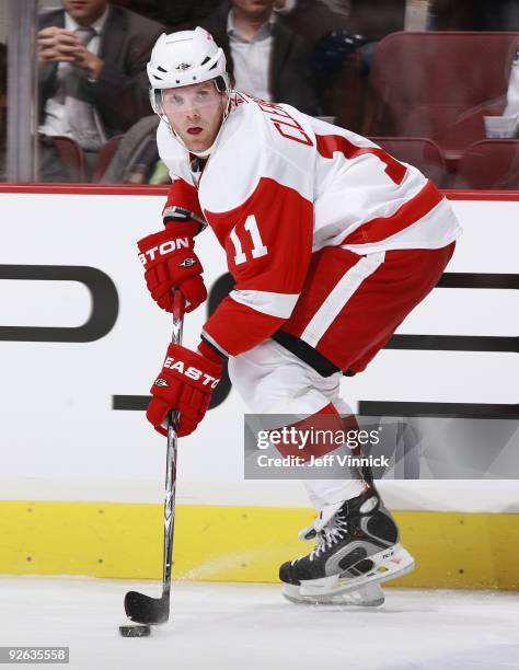 Dan Cleary of the Detroit Red Wings skates up ice with the puck during their game against the Vancouver Canucks at General Motors Place on October...