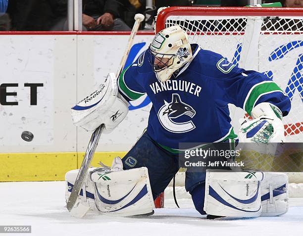 Roberto Luongo of the Vancouver Canucks makes a save during their game against the Detroit Red Wings at General Motors Place on October 27, 2009 in...