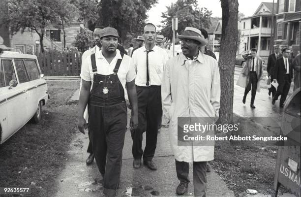 American Civil Rights activist Albert Raby , head of Coordinating Council of Community Organizations , and comedian and social activist Dick Gregory...