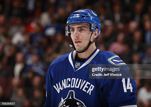 Alex Burrows of the Vancouver Canucks looks on from the bench during their game against the Detroit Red Wings at General Motors Place on October 27,...