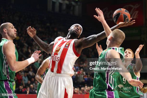 Mathias Lessort, #26 of Crvena Zvezda mts Belgrade competes with Alberto Diaz, #9 of Unicaja Malaga and James Augustine, #40 of Unicaja Malaga during...