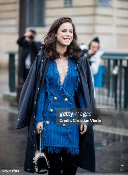 German singer Lena Meyer-Landrut wearing Balmain dress, Balenciaga coat, over knees boots, bag on March 2, 2018 in Paris, France.