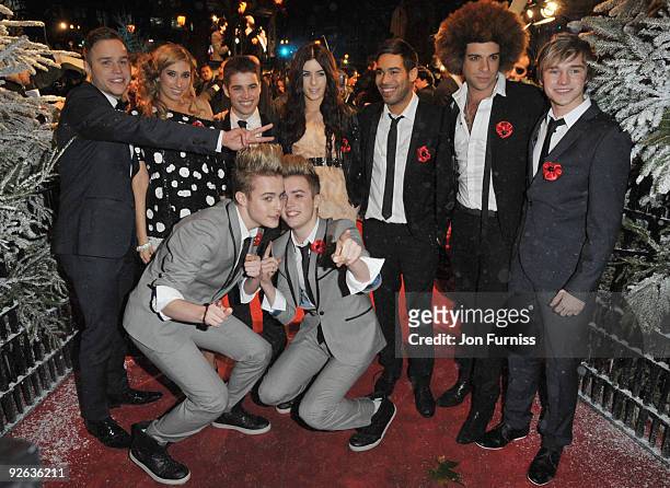 John Grimes and Edward Grimes pose with fellow X-Factor contestants at the World Premiere of 'A Christmas Carol' at the Odeon Leicester Square on...