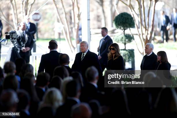 President Donald Trump, first lady Melania Trump, U.S. Vice President Mike Pence and his wife, second lady Karen Pence arrive to join mourners paying...