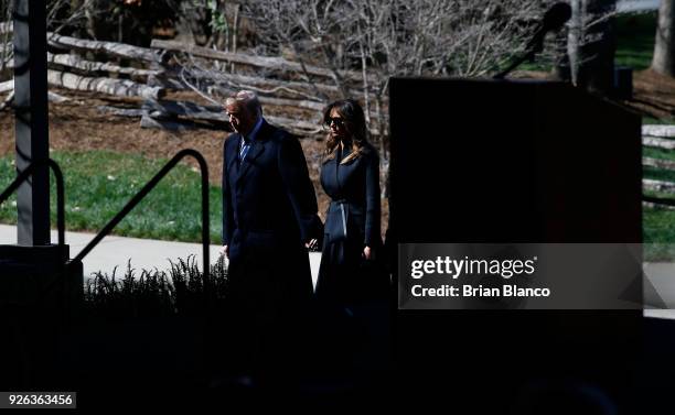 President Donald Trump and first lady Melania Trump arrive to join mourners paying their respects at a funeral service for Rev. Billy Graham at the...