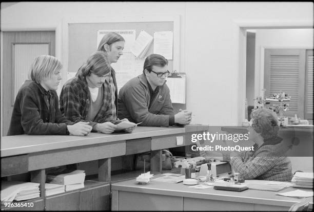 At a Selective Service Office, a group of young men register for the draft, Hyattsville, Maryland, February 16, 1977.