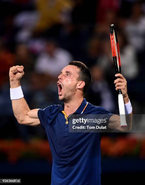 Roberto Bautista Agut of Spain celebrates winning his semi final match against Malek Jaziri of Tunisia on day five of the ATP Dubai Duty Free Tennis...