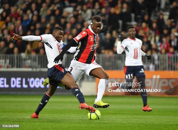 Nice's Italian forward Mario Balotelli vies with Lille's French midefielder Ibrahim Amadou during the French L1 football match Nice vs Lille on March...