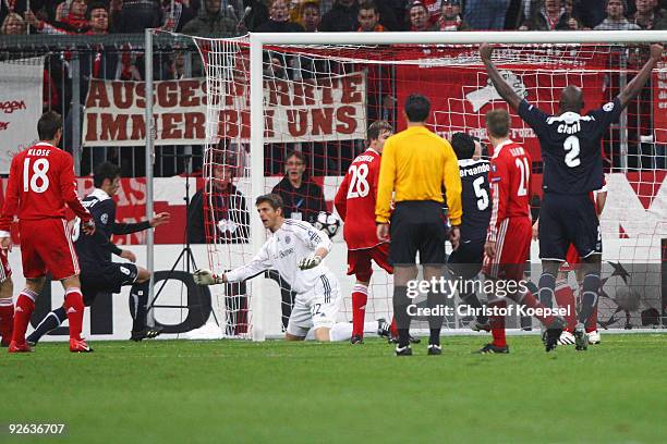 Yoann Gourcuff of Bordeaux scores his team's first goal against goalkeeper Joerg Butt of Bayern during the UEFA Champions League Group A match...