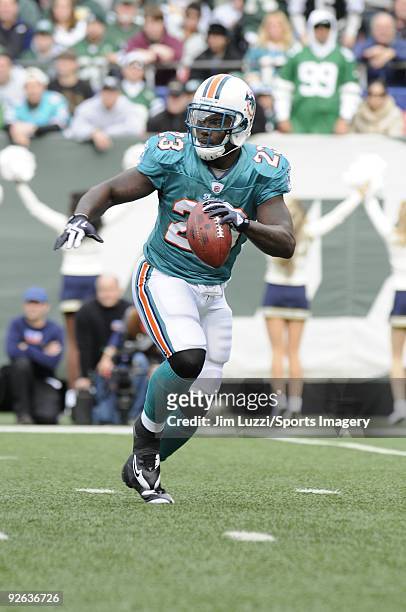 Ronnie Brown of the Miami Dolphins carries the ball during a game against the New York Jets at Giants Stadium on November 1, 2009 in East Rutherford,...