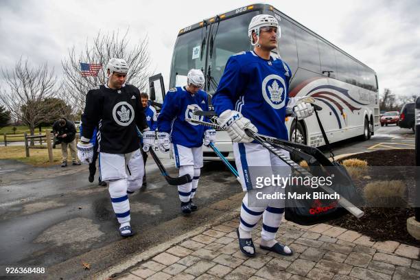 Patrick Marleau, Mitch Marner, and Roman Polak of the Toronto Maple Leafs arrive for their team practice a day before their NHL Stadium Series Game...
