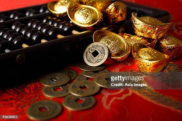still life of old chinese money and abacus. - gold abacus stock pictures, royalty-free photos & images