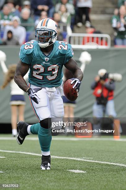 Ronnie Brown of the Miami Dolphins carries the ball during a game against the New York Jets at Giants Stadium on November 1, 2009 in East Rutherford,...