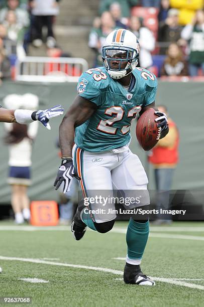 Ronnie Brown of the Miami Dolphins carries the ball during a game against the New York Jets at Giants Stadium on November 1, 2009 in East Rutherford,...