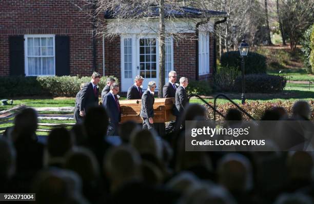 Pallbearers carry the casket away after the funeral of Reverend Dr. Billy Graham in Charlotte, North Carolina. Graham, who preached to millions of...
