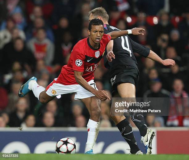 Nani of Manchester United clashes with Vasili Berezutski of CSKA Moscow during the UEFA Champions League match between Manchester United and CSKA...