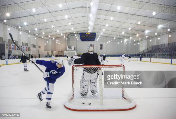 Mitch Marner and Frederik Andersen of the Toronto Maple Leafs take part in team practice a day before their outdoor NHL Stadium Series Game against...