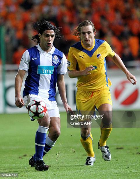 Porto's Falcao competes with Apoel Nicosia's Joost Broerse during their UEFA Champions League group D football match at the GSP Stadium in Nicosia on...