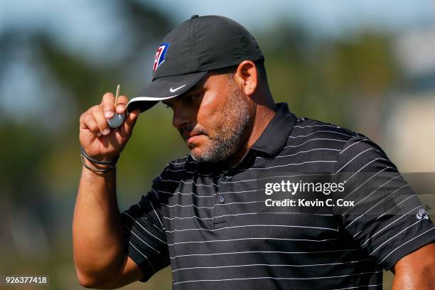 Major League Baseball Hall of Famer Ivan "Pudge" Rodriguez looks on prior to playing his tee shot on the first hole during the first day of the...