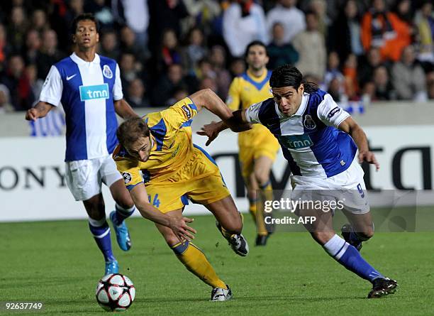 Porto's Falcao competes with Apoel Nicosia's Christos Kontis during their UEFA Champions League group D football match at the GSP Stadium in Nicosia...