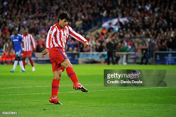 Sergio Aguero of Atletico Madrid shoots and scores the first goal of the game during Champions League Group D match between Atletico Madrid and...