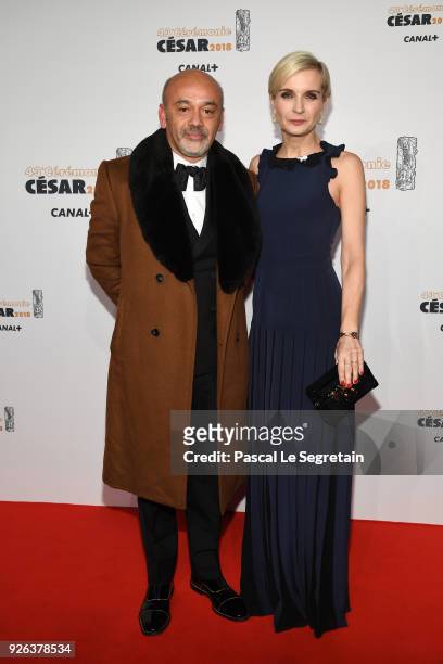 Christian Louboutin and Melita Toscan du Plantier arrive at the Cesar Film Awards 2018 at Salle Pleyel on March 2, 2018 in Paris, France.