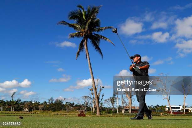 Major League Baseball Hall of Famer Ivan "Pudge" Rodriguez plays his tee shot on the first hole during the first day of the Puerto Rico Open Charity...