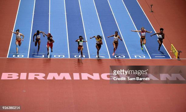 Birmingham , United Kingdom - 2 March 2018; Marie-josée Ta Lou of Ivory Coast, centre, crosses the lien to win her Women's 60m Semi-Final on Day Two...