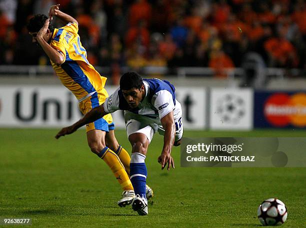 Apoel Nicosia's Helio Pinto gestures after fouling FC Porto's Hulk during their UEFA Champions League group D football match at the GSP Stadium in...