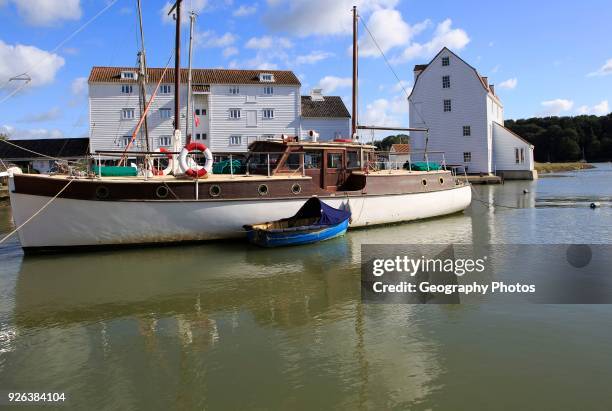 Historic boat and Tide Mill on the waterfront, River Deben, Woodbridge, Suffolk, England, UK.