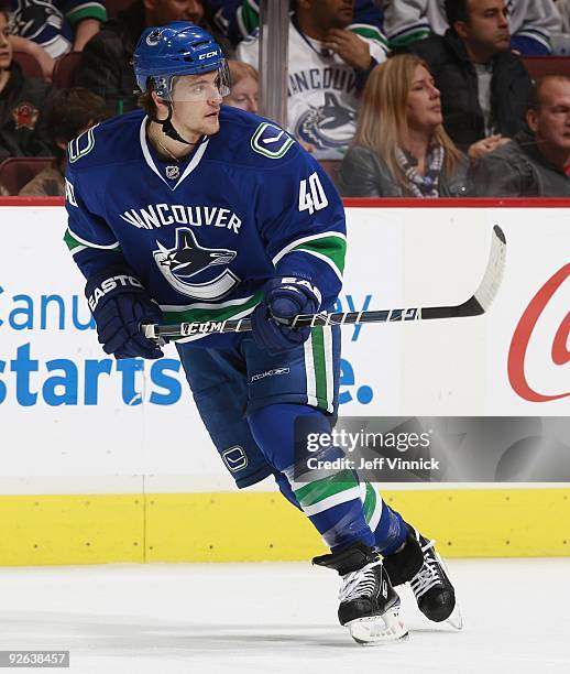 Michael Grabner of the Vancouver Canucks skates up ice during their game against the Edmonton Oilers at General Motors Place on October 25, 2009 in...